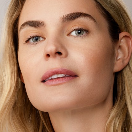 Feel more confident and satisfied with Addyi benefits Confident woman with natural makeup looking relaxed and empowered