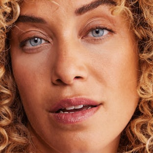 Enhanced product absorption Woman with healthy, dewy skin representing improved skincare absorption